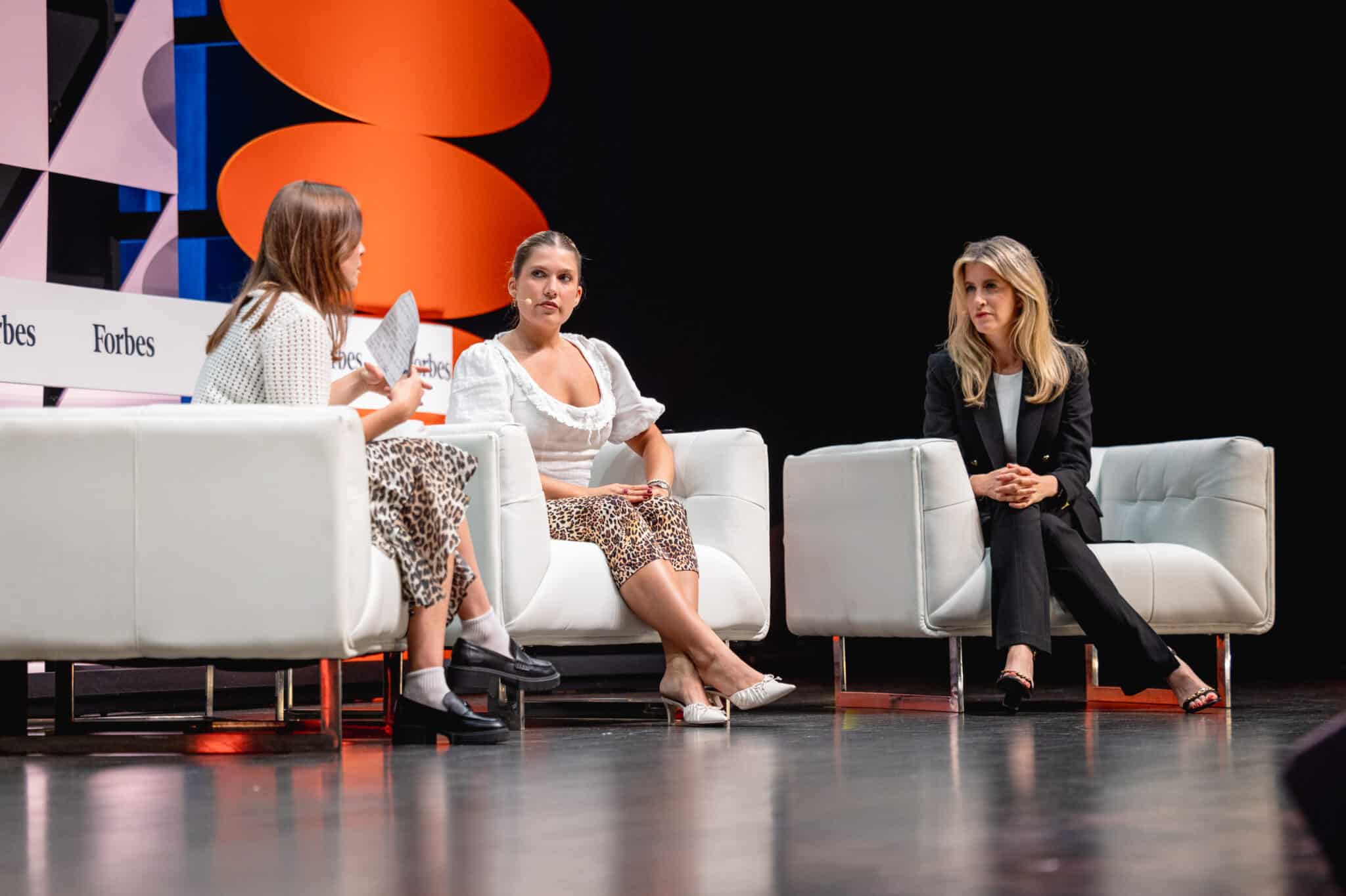 Three speakers on stage