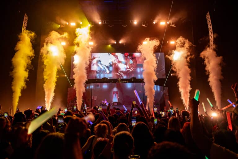 Pyrotechnics active in front of a custom Video Projection DJ Booth at Forbes Under 30 Summit Concert in 2024