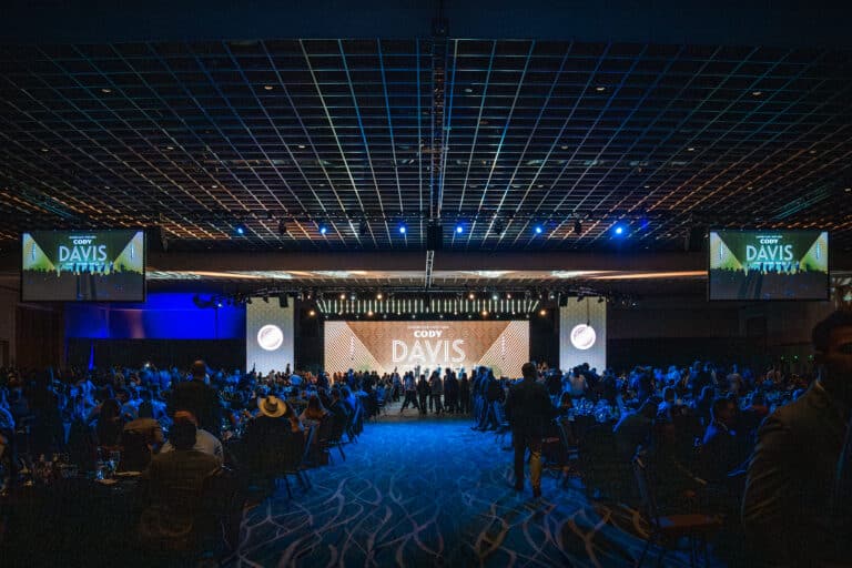 Front view of Sherwin Williams stage with lighting and screens